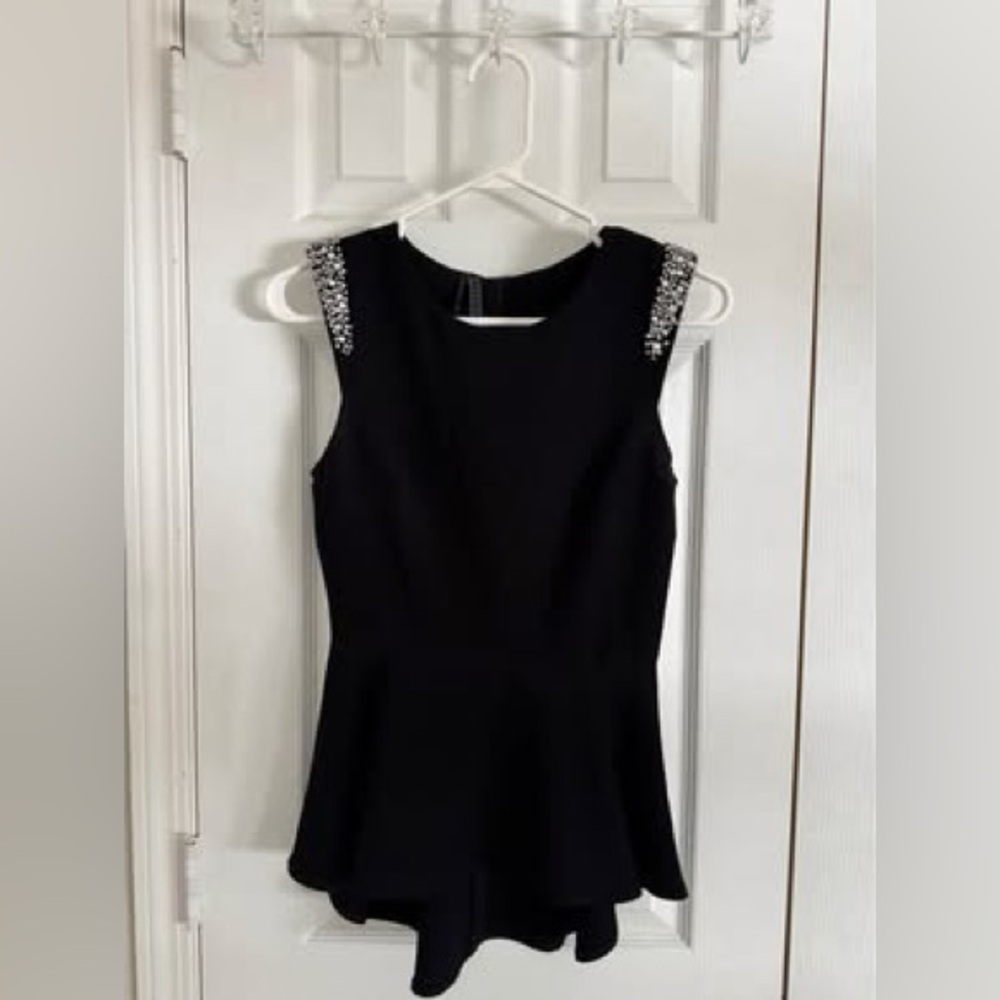 Guess black peplum top, with stunning rhinestone details